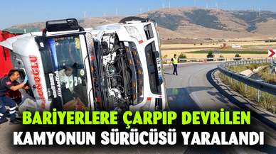 Bariyerlere çarpıp devrilen kamyonun sürücüsü yaralandı