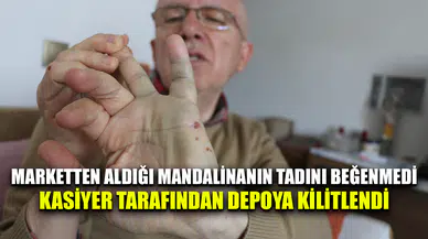 Kadın kasiyer mandalinanın tadını beğenmeyen müşteriyi dolaba killitledi