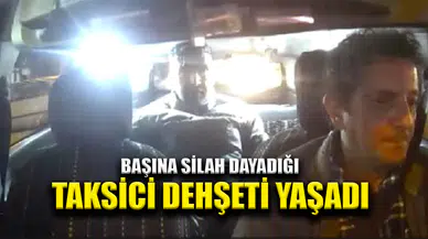Taksicinin başına silah dayadı